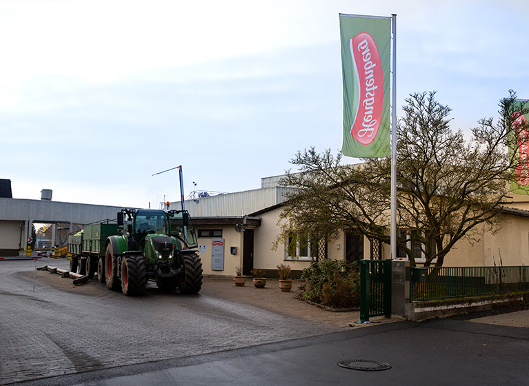 A tractor in front of the factory in Fritzlar.