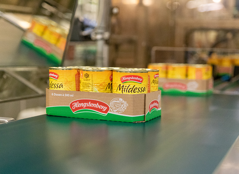 A tray with cans of Mildessa Sauerkraut.