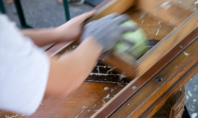 Cabbage is getting sliced in the past.