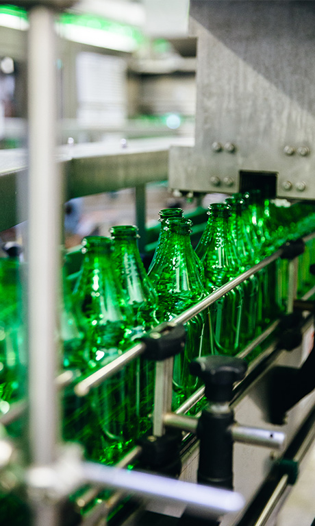 Vinegar bottles in a machine.