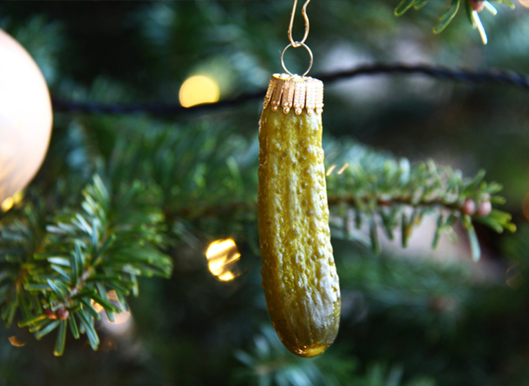 A cucumber hanging in the Christmas tree.