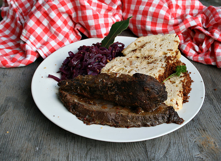 A white plate with czech red cabbage.