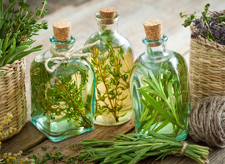 Three bottles of herbal vinegar.